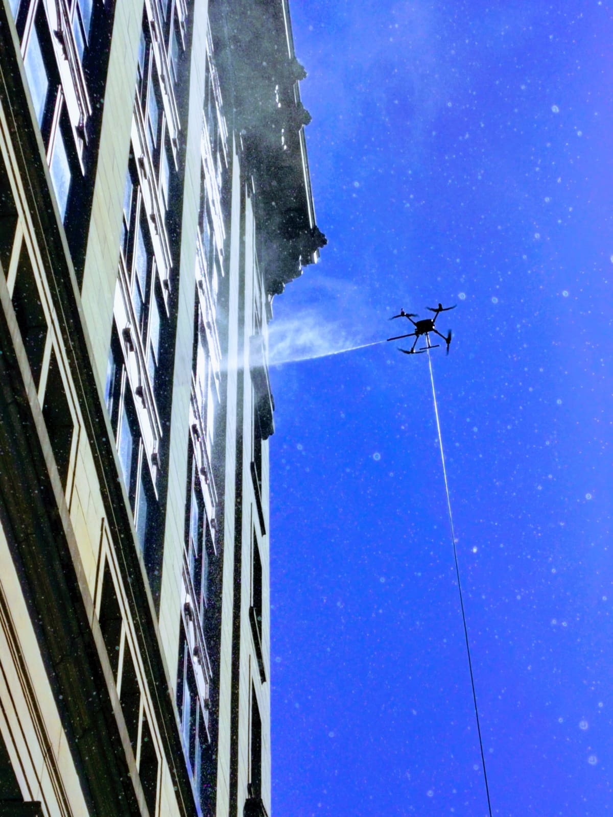 Working the upper floors of a tower from the ground.
