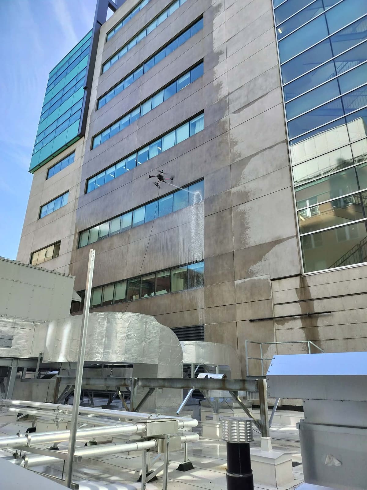 Glass facade cleaned by drone